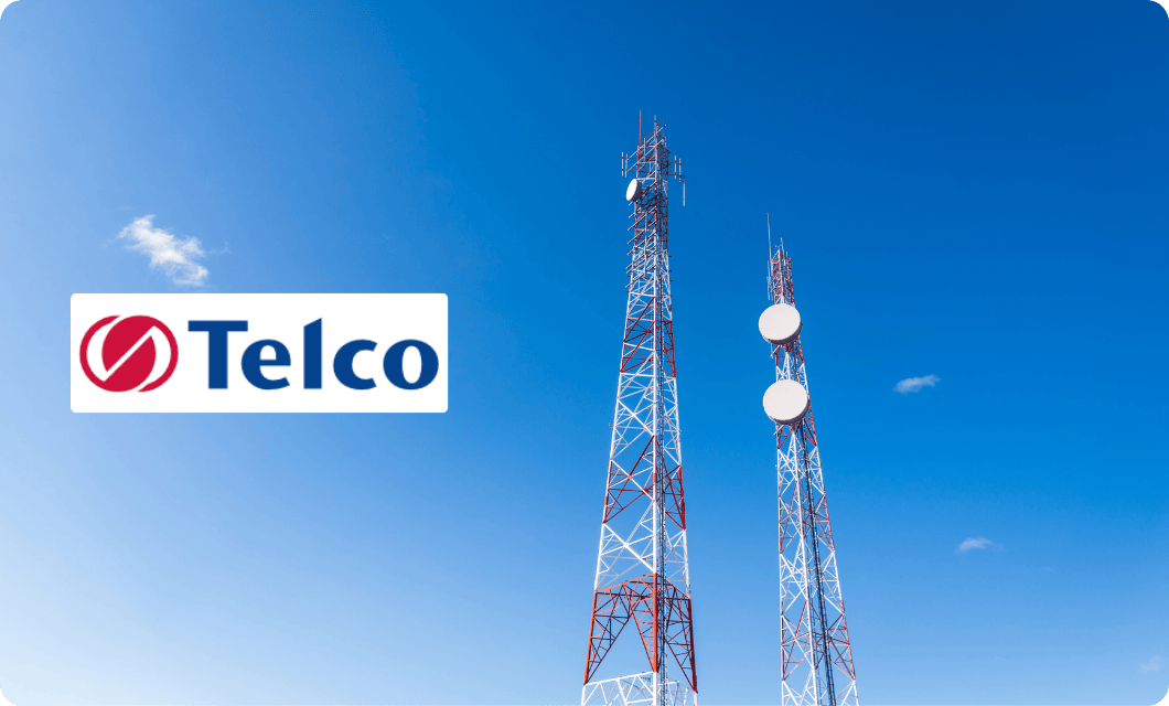 Telecom towers against a clear blue sky, symbolizing global connectivity, operational infrastructure, and digital transformation in telecommunications.